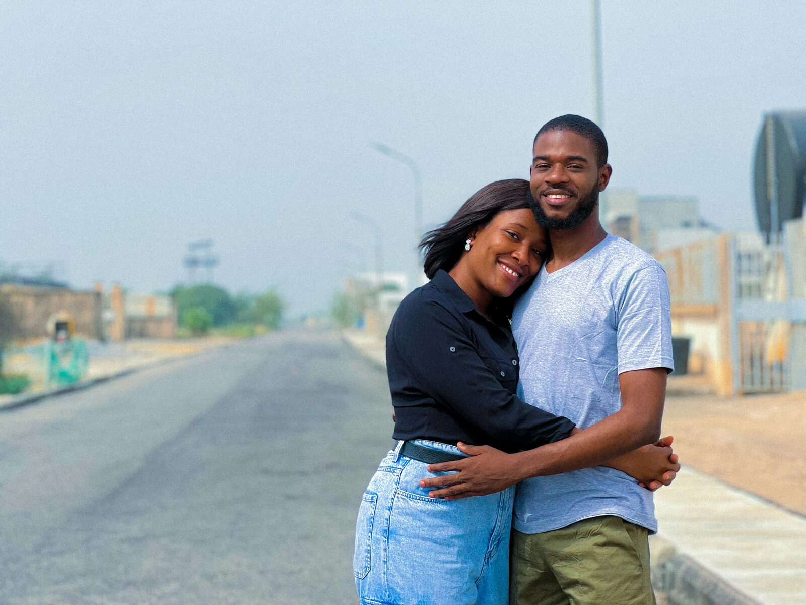 A first responder couple smiling together