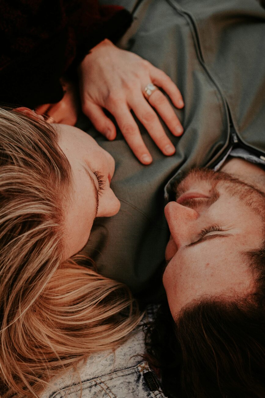 A married couple resting close together